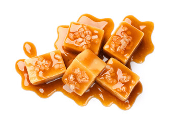 Tasty candies with salt and caramel sauce isolated on white, top view