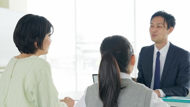 Parent and child having a three-way consultation