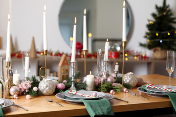 Festive table setting with Christmas decor at home, closeup