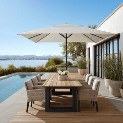 Obraz premium Outdoor dining table with wicker chair wooden deck large umbrella pool potted plant modern house blue sky lake view summer
