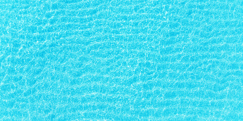 turquoise ocean waves, top view. Blue sea surface with transparent water as background