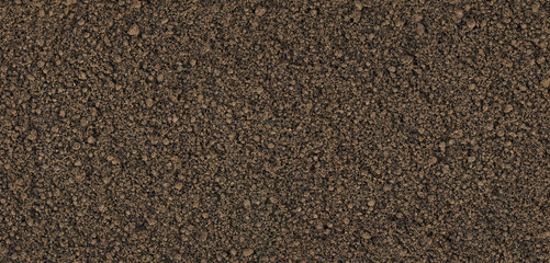 natural black earth on a garden bed, loose humus background