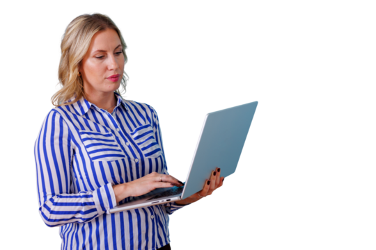 Blonde businesswoman standing, typing on laptop, using technology for remote work or online communication on transparent background - Powered by Adobe