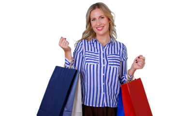 Young blond woman smiling, holding multiple shopping bags. She is enjoying retail shopping and sale discounts. Transparent background