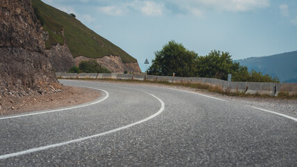 empty road in the mountains without people and without cars