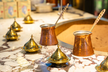 Copper hand-operated coffee pots, called Turks, at a Turkish bazaar for making coffee on sand.