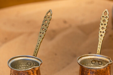 Copper hand-operated coffee pots, called Turks, at a Turkish bazaar for making coffee on sand.