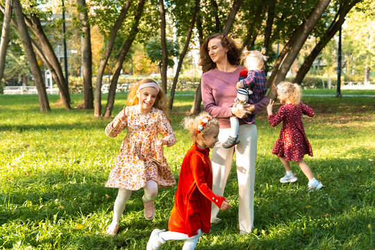 Mother enjoying quality time with daughters in park