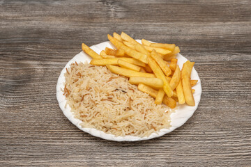 An extreme close-up reveals the porous, crispy texture of a single fries, with salt crystals clinging to its irregular surface.