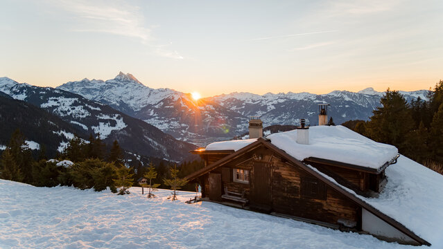 Snowy Switzerland landscape at sunset during winter