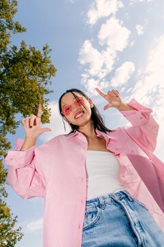 Asian girl enjoying a sunny day with joyful expression