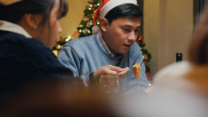 Group of Asia colleague gathering New year holidays party together. Group of happy friends enjoy...