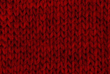 Texture of red knitted scarf close-up. Background texture.
