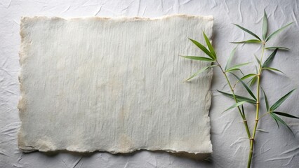 Serene handcrafted paper textured background with delicate bamboo sprigs for design inspiration