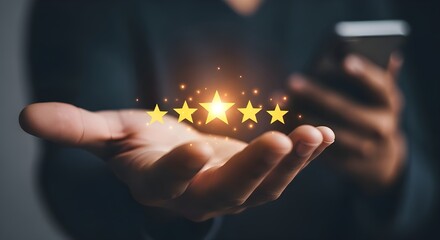 Customer satisfaction and excellent service represented by glowing stars held in a hand with a smartphone in the background