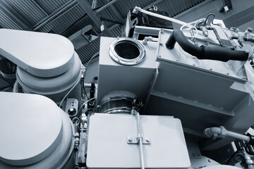 Industrial machine in a factory with many pipes and parts view from bottom to top, industrial concept background