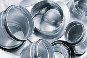 Industrial background of metal parts for ventilation ducts