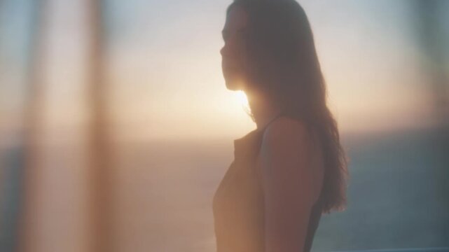 Silhouette of woman at sunset on Gran Canaria beach