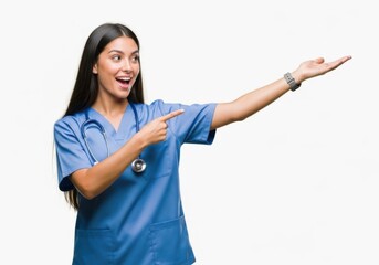 Young woman nurse pointing and presenting isolated on white background