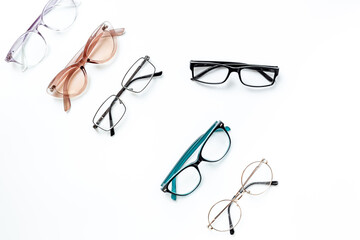 Eye care concept. Group of glasses on white background