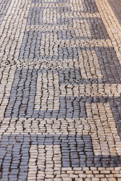 Traditional Portuguese cobblestone sidewalk in Lisbon