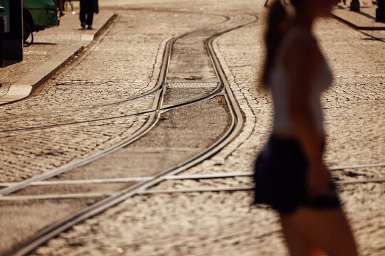 Lisbon tram tracks with silhouettes at sunset