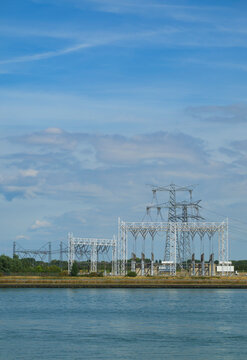 Power line and transformer station near water in the Netherlands
