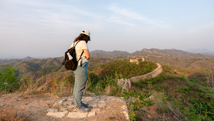 Woman enjoying view of Gubeikou on Great Wall of China