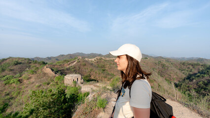 Young woman admiring Gubeikou section of Great Wall