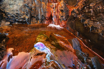 Portuguese man-of-war on rocky coast in Asturias