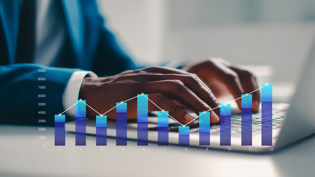 Businessman typing on laptop with financial growth chart and analytics.