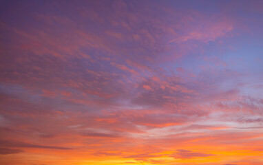 Clouds and sky backdrop at sunset and sunrise,Sunset Sky Clouds in the evening with Red, Orange, Yellow and purple sunlight on Golden hour after sundown, Romantic sky in summer on Dusk Twilight 