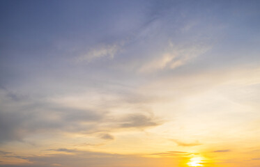 Obraz premium Clouds and orange sky backdrop,Sky,sunset, beautiful , luxury soft gradient orange gold clouds and sunlight on the blue sky perfect for the background, wilight summer,silhouette.