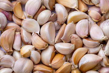 Close-up macro of garlic,Garlic bulbs on black background, close-up. Organic garlic top view. Food background. Selective focus.