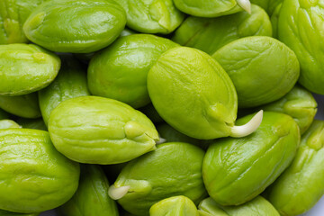 Green stink beans, a local food in southern Thailand,Macro stink bean seeds,Fresh peeled peat peas (nao beans), a traditional Indonesian tropical vegetable ready to cook.