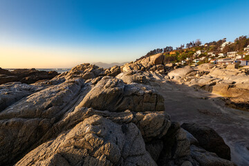 The rugged coastline and rocky beach of the Maitencillo resort town in the Valpara&iacute;so Region of Chile, at sunset.