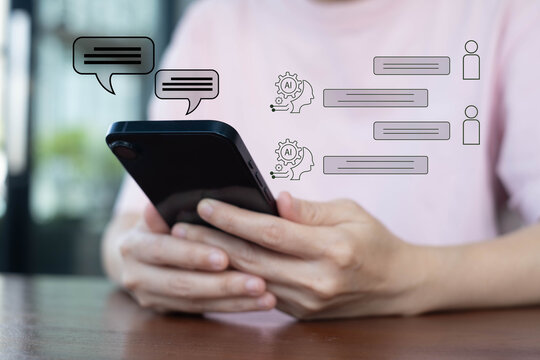 A person using a smartphone with AI chatbot icons and digital message bubbles, illustrating modern mobile communication, artificial intelligence interaction, and real-time online messaging technology. - Powered by Adobe