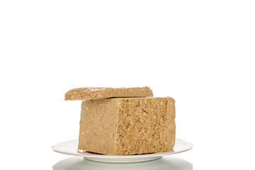 Fragrant sweet halva isolated on white background, macro.