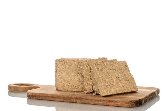 Fragrant sweet halva isolated on white background, macro.