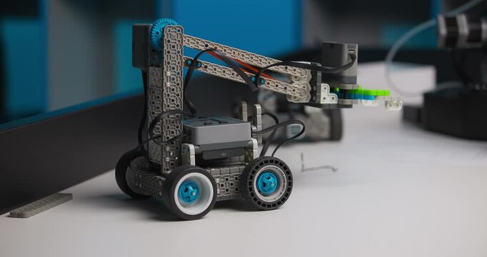 A self-automating robotic machine in action.a programmable robot with a manipulator. stem programming concepts