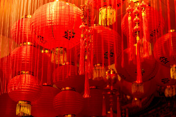 Traditional red Chinese lanterns glowing at night. Chinese New Year, New Year banner. Concept...