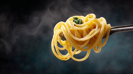 A spoonful of pasta with a green herb on top. The pasta is yellow and the green herb is fresh