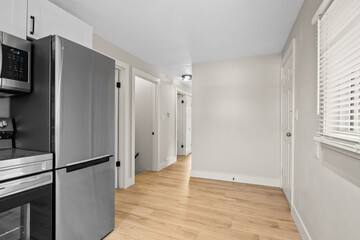 Kitchen with a refrigerator, microwave, and oven