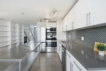 Large kitchen with a countertop and a sink