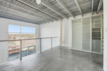 Large open room with a window overlooking the city