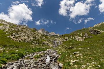 View on a waterfall in the Lauzière massif , Savoie , France 