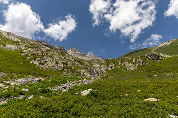 View on a waterfall in the Lauzière massif , Savoie , France 