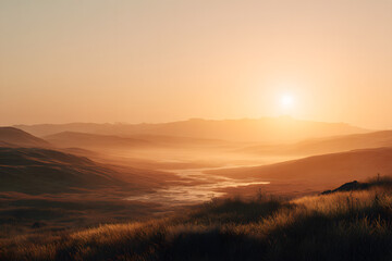 Fototapeta premium soft golden sunrise spreading above a quiet landscape with warm glow creating calm cinematic morning light