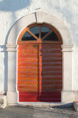 Wooden Door with Stone Frame in Drivenik, Croatia – Traditional Mediterranean Architecture