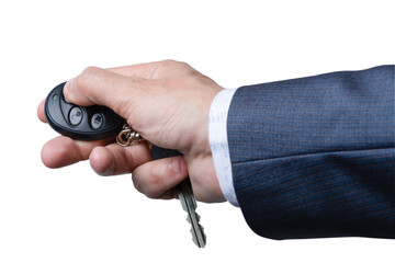 Hand holding remote key fob with keys in suit while preparing to unlock car door